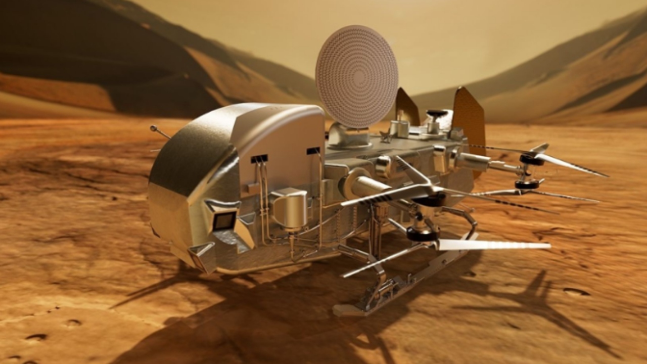 Representação artística do Dragonfly, o primeiro helicóptero da NASA a explorar Titã / Créditos: NASA/Johns Hopkins APL