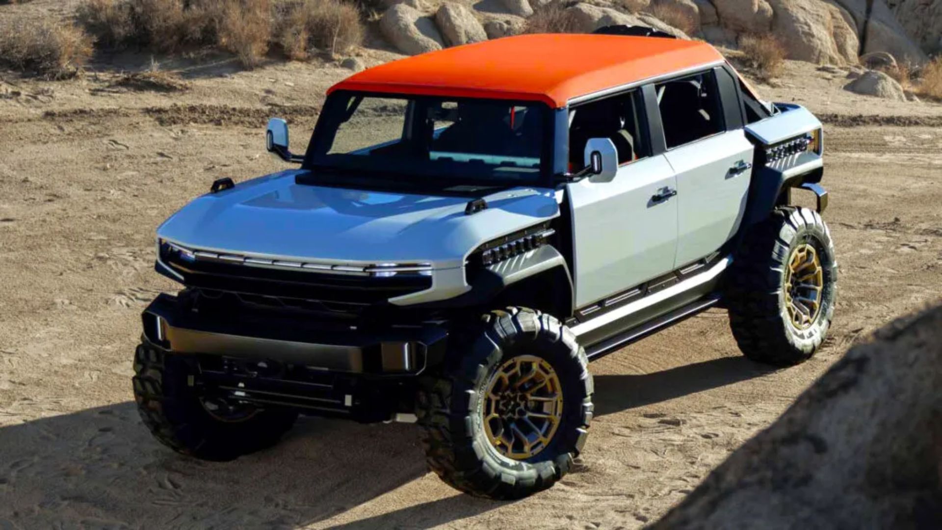 Conceito GMC Hummer X SUV 2026 em trilha off-road durante apresentação da General Motors nos Estados Unidos.