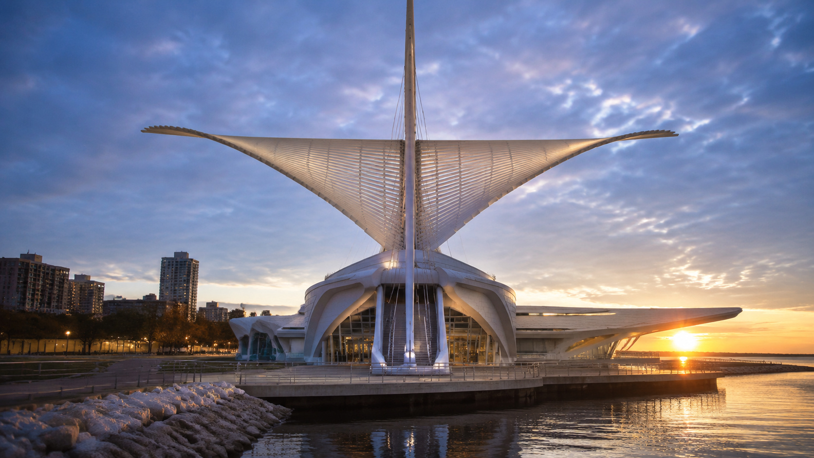 um museu em Wisconsin usa asas móveis de 66 metros para controlar luz natural e criar efeito de pássaro gigante sobre seu salão de vidro
