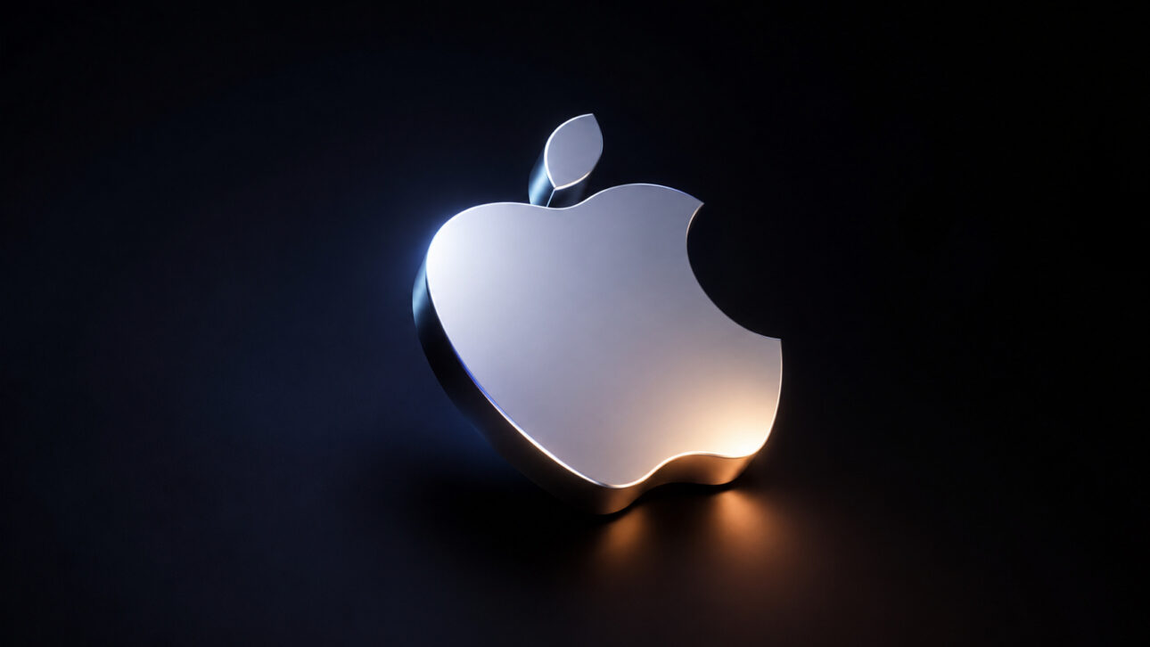 Logotipo brilhante da Apple em fundo escuro, representando os indícios encontrados no iOS 27 que sugerem a chegada de um possível iPhone dobrável e uma nova fase de inovação da empresa.