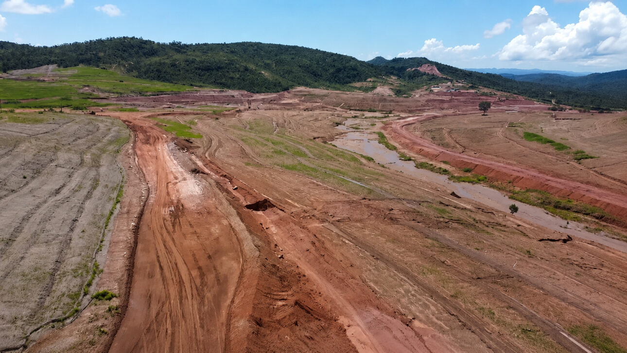 Aerial view of extensive mining area in Goiás with excavated soil, dirt roads, and mineral movement marks on property associated with rare earth exploration.