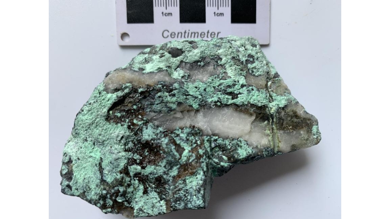 Greenish mineral sample associated with the discovery of Jinxiuite, a new mineral identified in China in a nickel and cobalt-rich deposit.