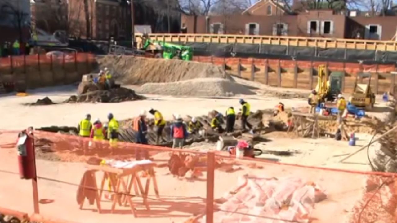 Ship in Alexandria reveals Potomac River, colonial warehouse, and old shoes under hotel construction.