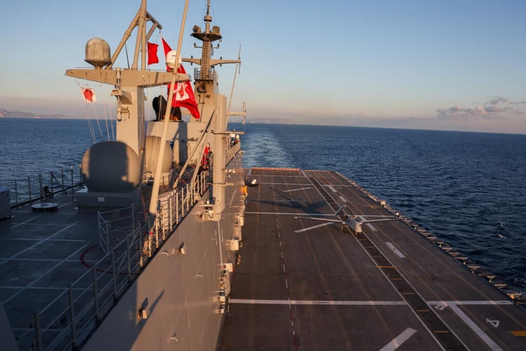 Military drone Bayraktar TB3 in flight over the sea