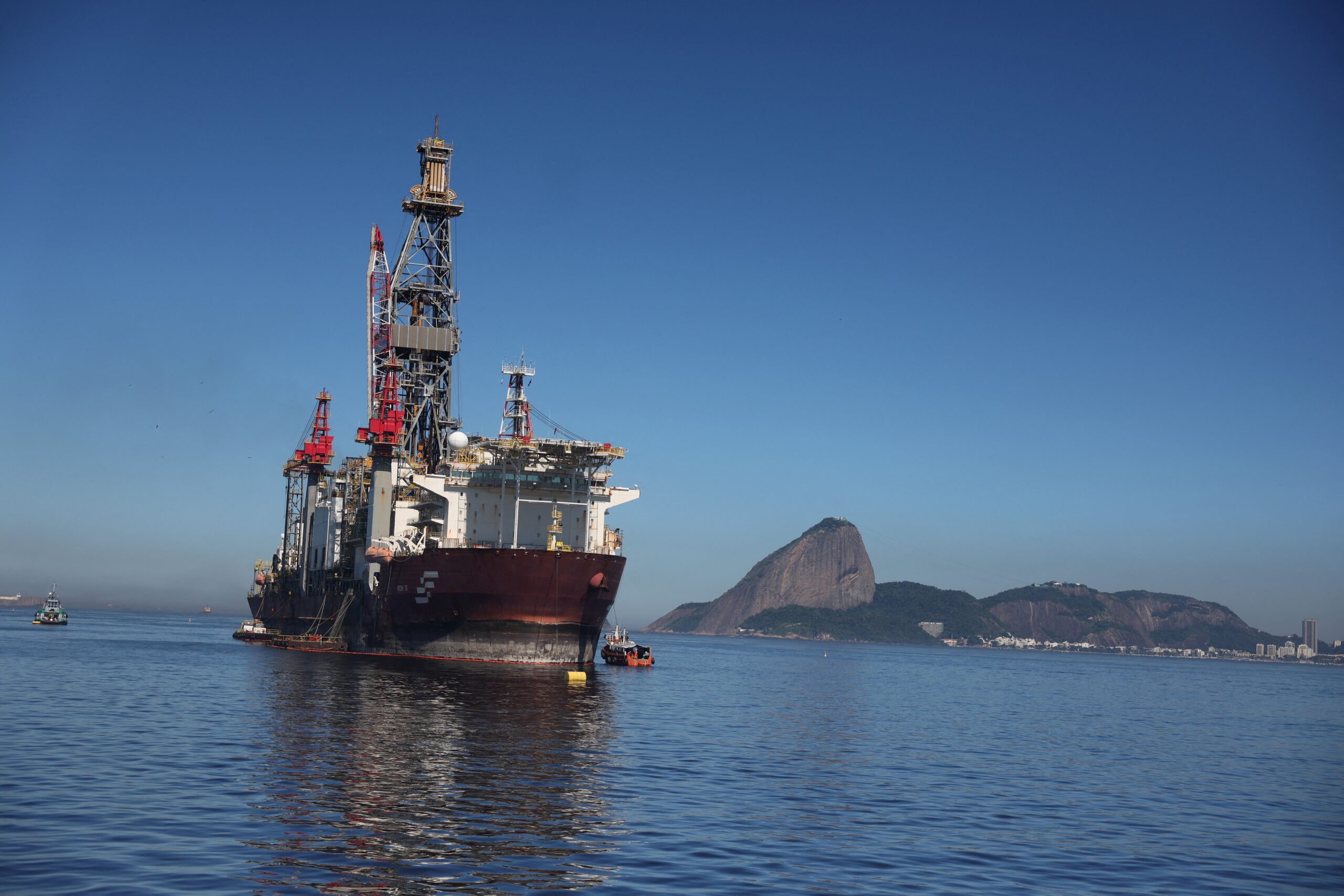 Oil drilling platform and ship at sea