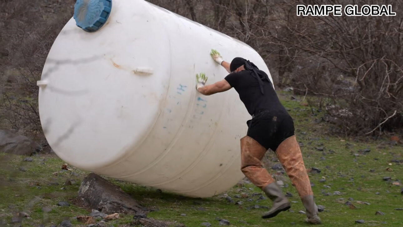 Reused water tank becomes hobbit-style house