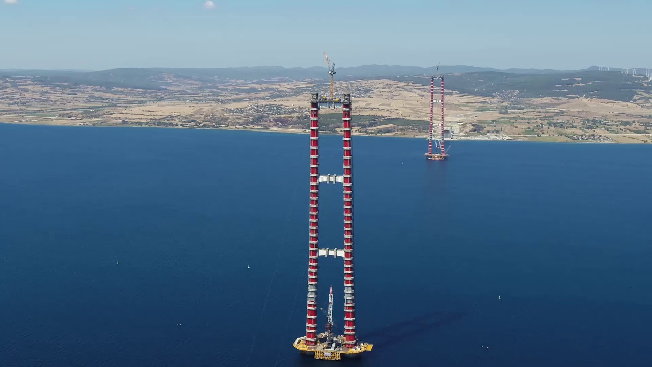 At midnight, 330-ton crane lifted 155-ton piece to 318 meters over the Dardanelles Strait marking the record hoisting of the 1915 Çanakkale Bridge, the largest suspension bridge on the planet