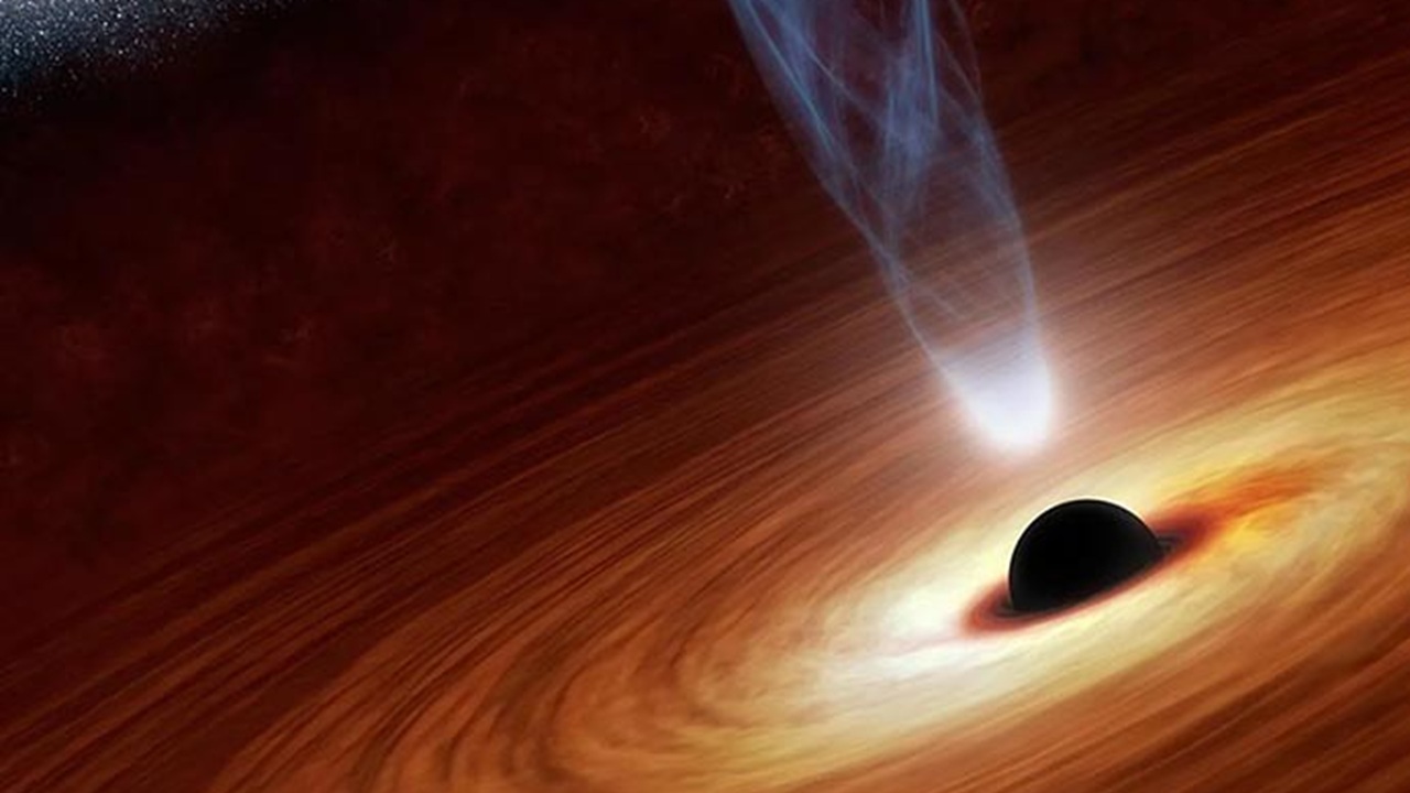 Descubra o buraco negro Phoenix A* e sua surpreendente massa de 100 bilhões de sóis, desafiando noções sobre tamanho.
