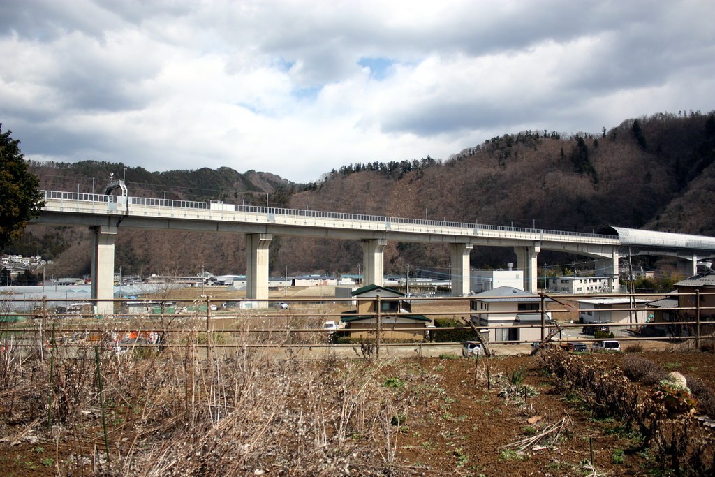 High-speed railway viaduct crossing mountainous valley in Japan