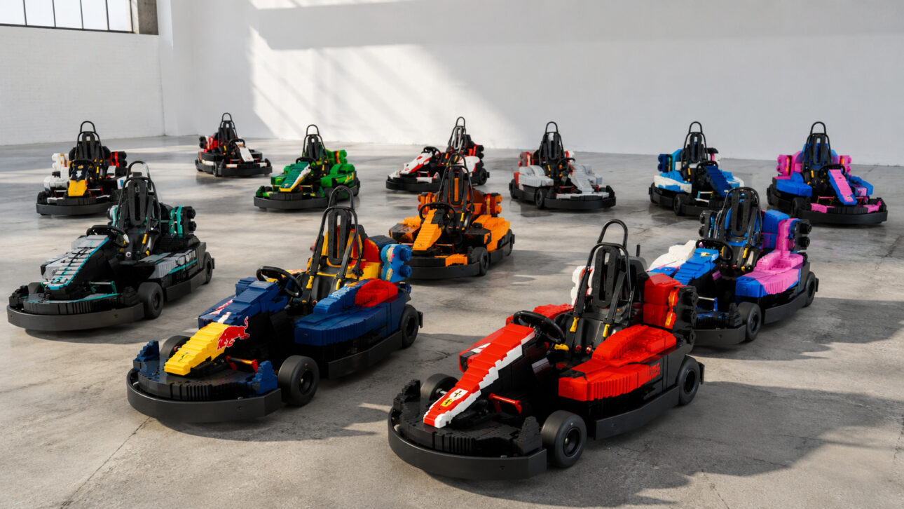 Several electric karts made with colorful building blocks, inspired by Formula 1 teams, organized in a large studio.