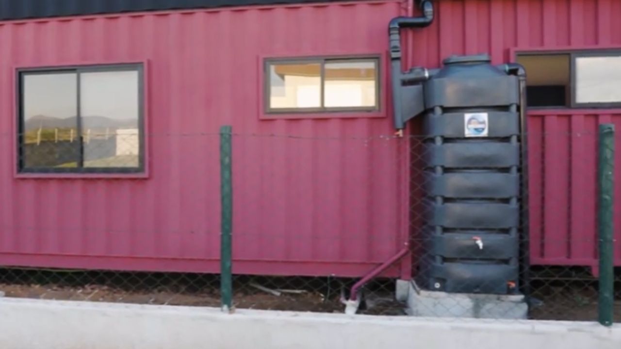 vertical cistern becomes water tank for potable water with reservoir and booster pump in compact house.