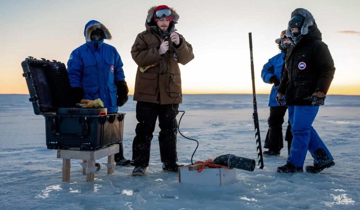 Researchers prepare equipment and measurement points on the sea ice in Cambridge Bay during the experimental campaign conducted in January 2025. Credit: Real Ice/Centre for Climate Repair.