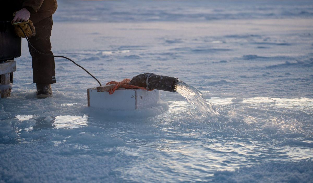 Pump used in a previous Real Ice campaign sprays seawater over the frozen surface in Cambridge Bay