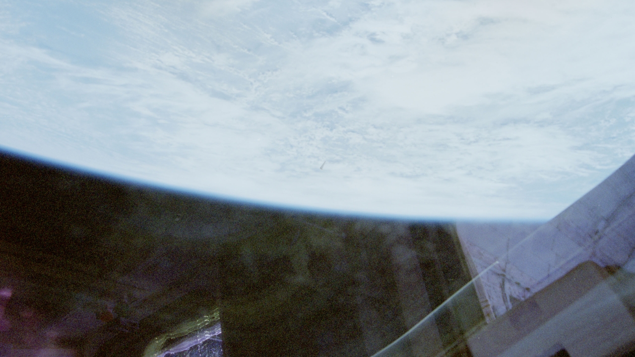 The third record released by the United States government shows the unidentified object against the backdrop of Earth and clouds, concluding the series of three photographs taken during the Columbia space shuttle flight in 1996. Source: NASA/WAR.GOV/UFO.