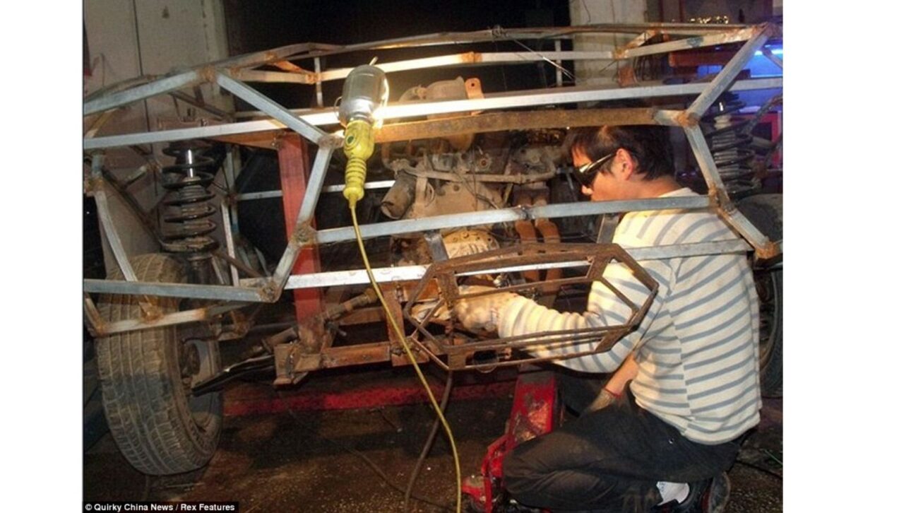 Wang Jian, from Jiangsu province, China, works on a homemade Lamborghini Reventon supercar.