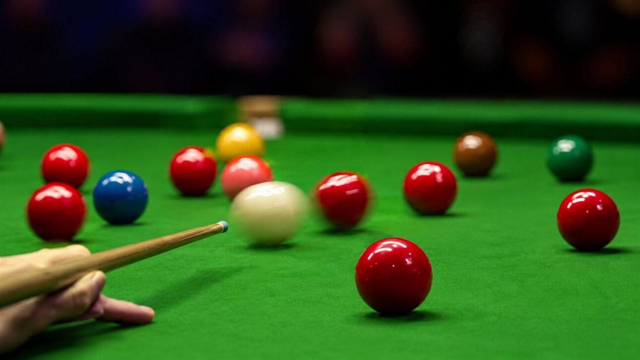 Shot on a professional pool table with balls scattering