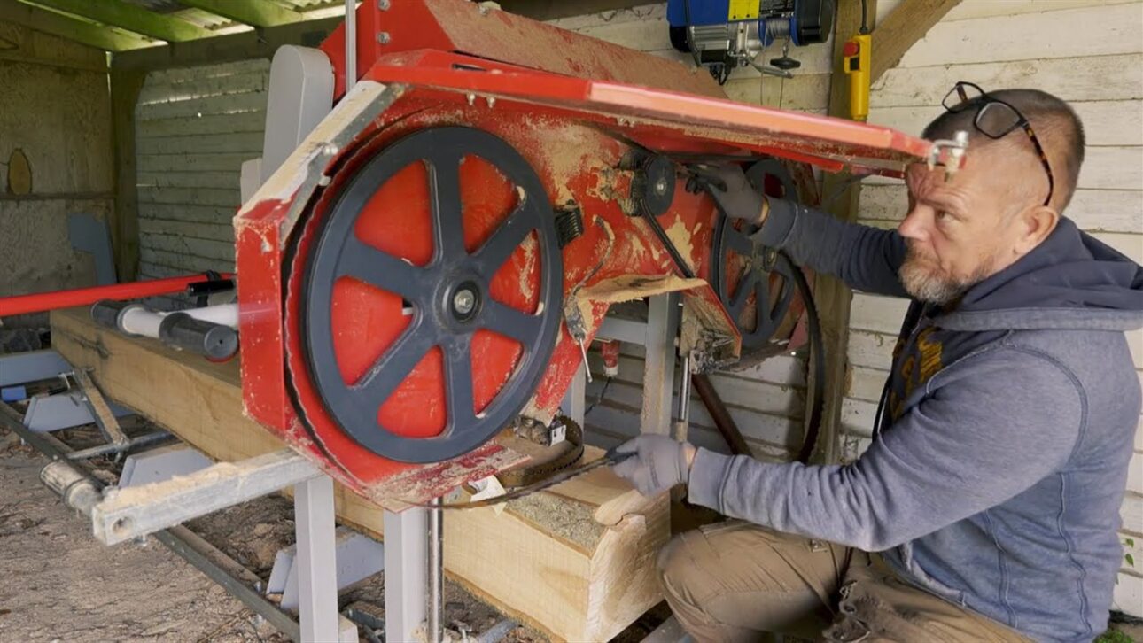 The homemade sawmill transforms the logs into beams for the cabin.