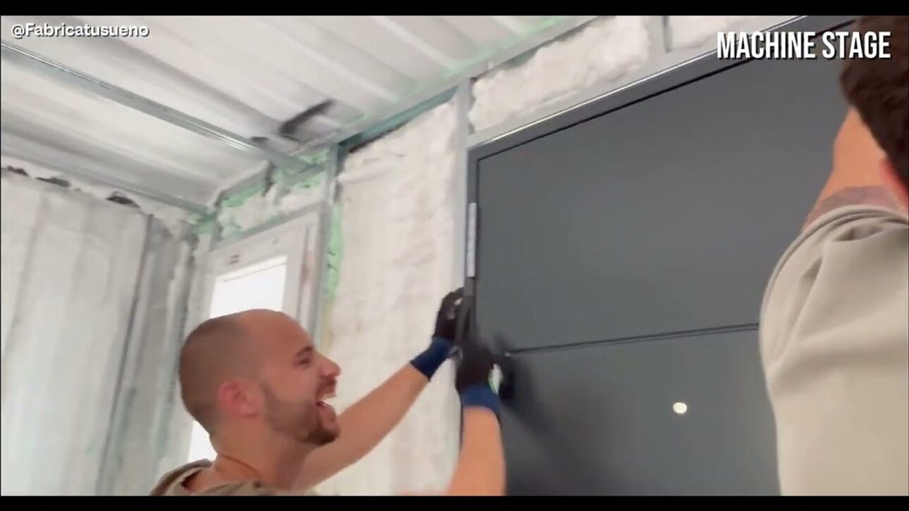 Man transforms rusty shipping container into luxury container home with insulating foam, large glass windows, and drywall; see each stage of the work