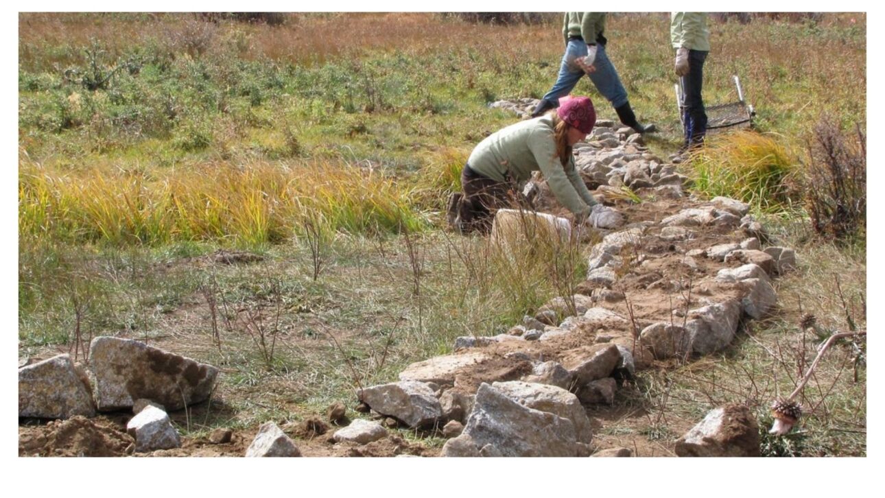 stones are placed, one at a time, in positions that seem random and are not. The arrangement follows a design intended for how the current will behave in the next flood.
