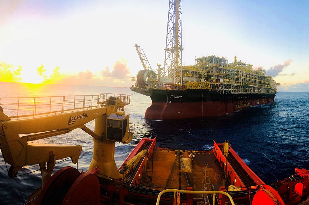 Offshore oil platform at sunset in open sea