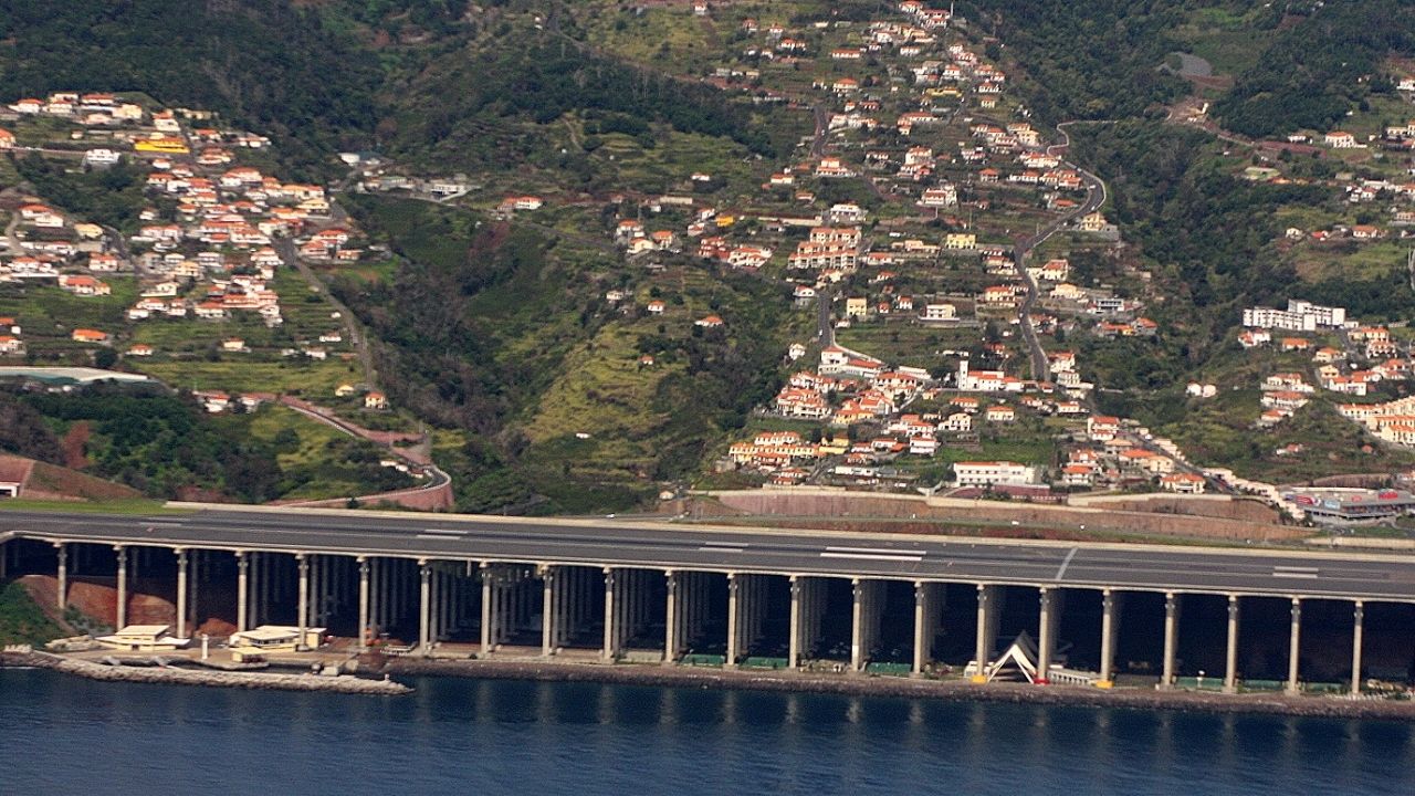 Madeira Airport runway is supported by 180 concrete pillars between mountains, an engineering solution to address the lack of flat terrain.