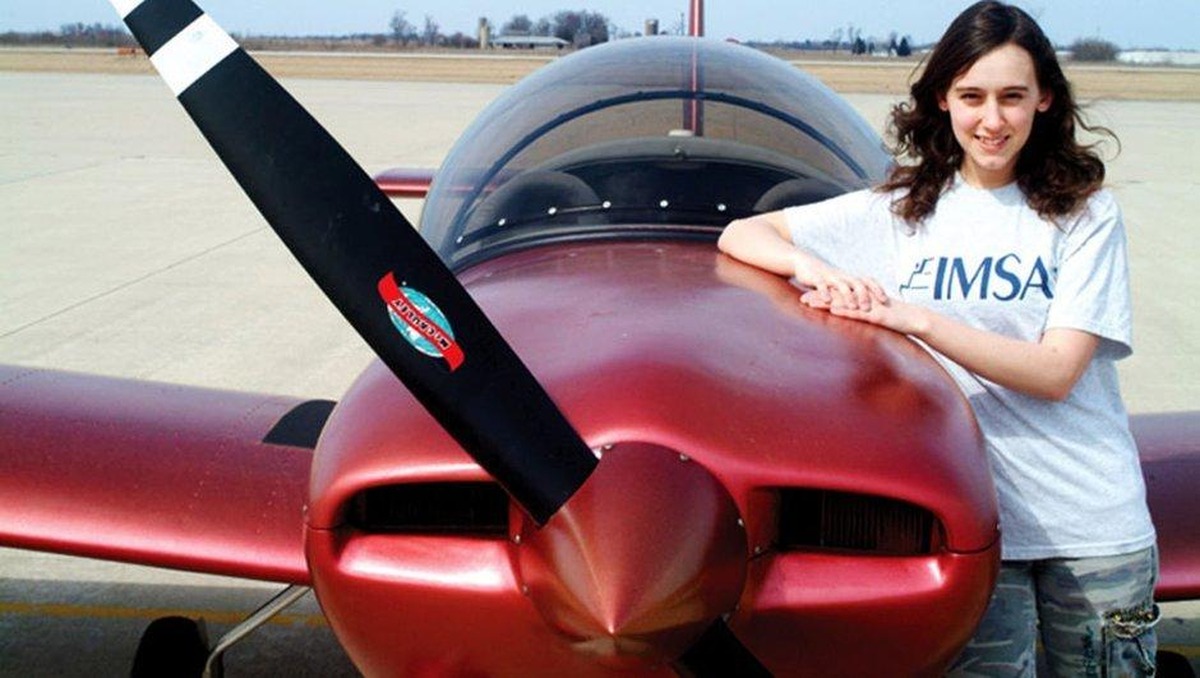 Sabrina Gonzalez Pasterski next to the aircraft she built before turning 16, which aided her acceptance to MIT.